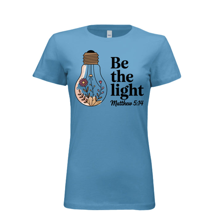 Women's fitted tee in aqua with a floral light bulb graphic and the words “Be the light – Matthew 5:14” in bold and script fonts.