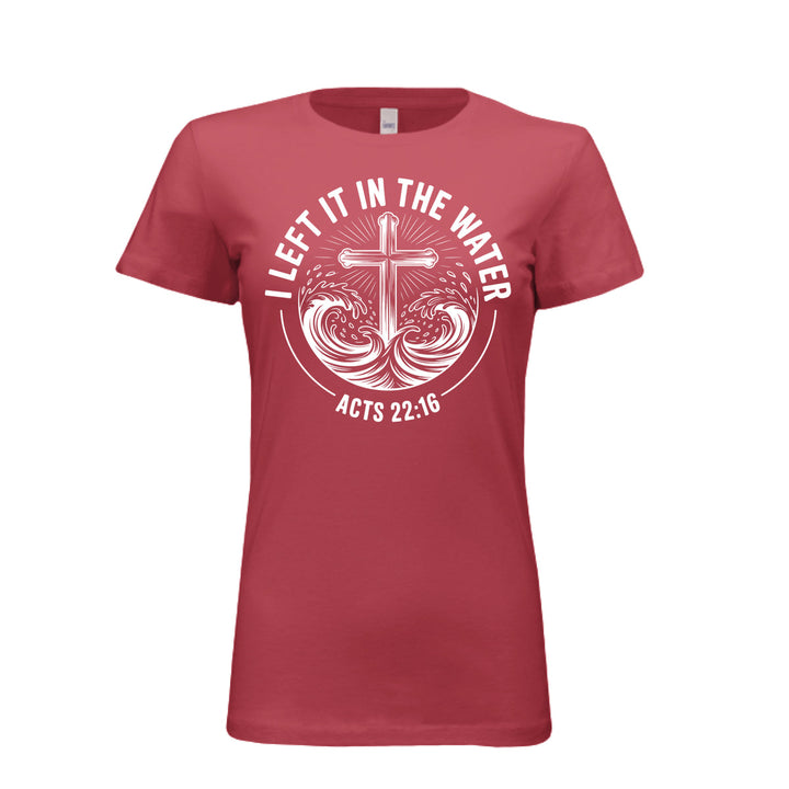 Women's fitted cardinal tee featuring a white cross rising from stylized waves with the words “I Left It in the Water – Acts 22:16” in bold curved text