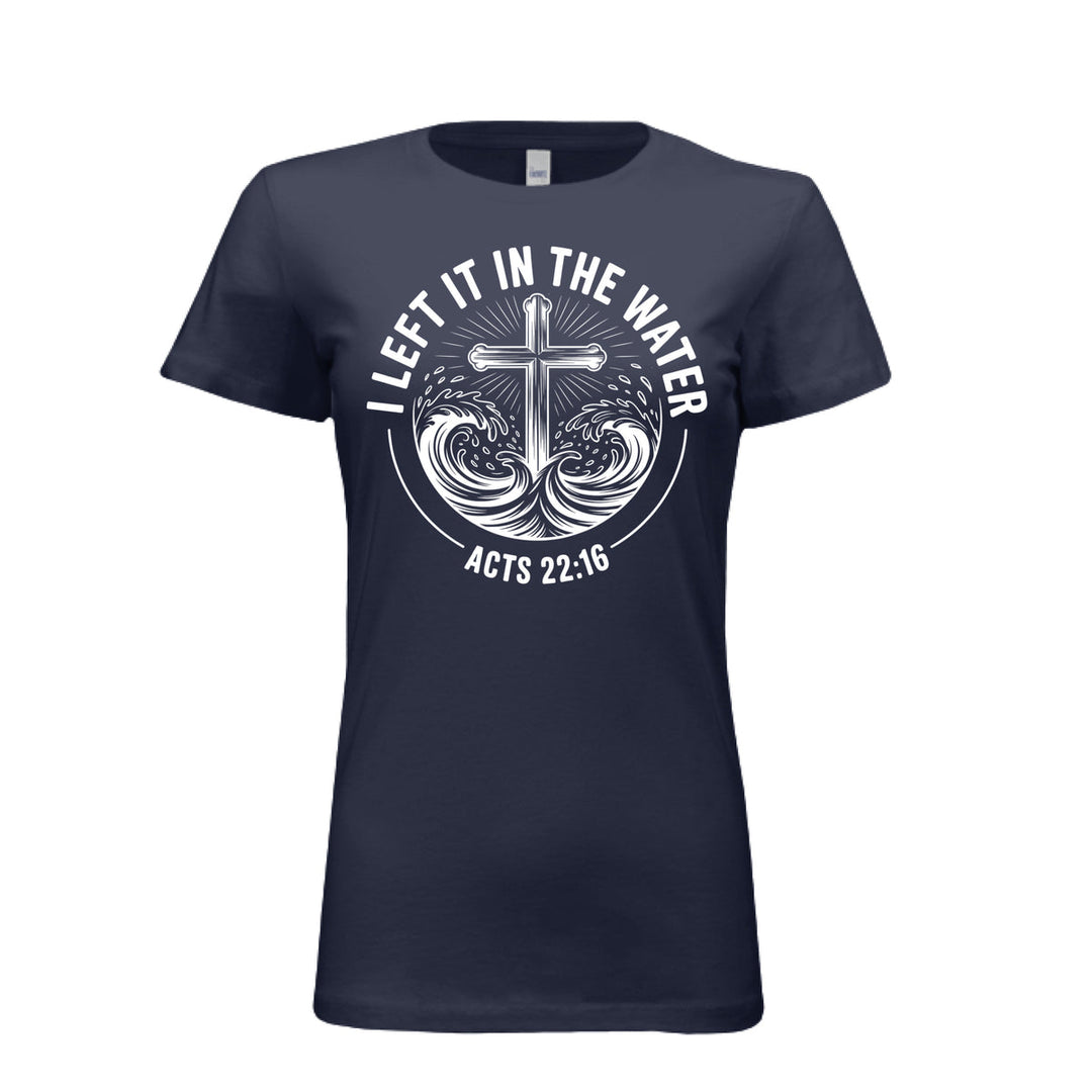 Women's fitted navy tee featuring a white cross rising from stylized waves with the words “I Left It in the Water – Acts 22:16” in bold curved text