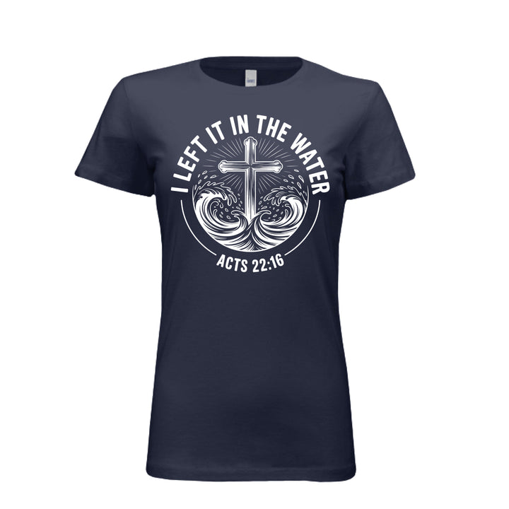Women's fitted navy tee featuring a white cross rising from stylized waves with the words “I Left It in the Water – Acts 22:16” in bold curved text