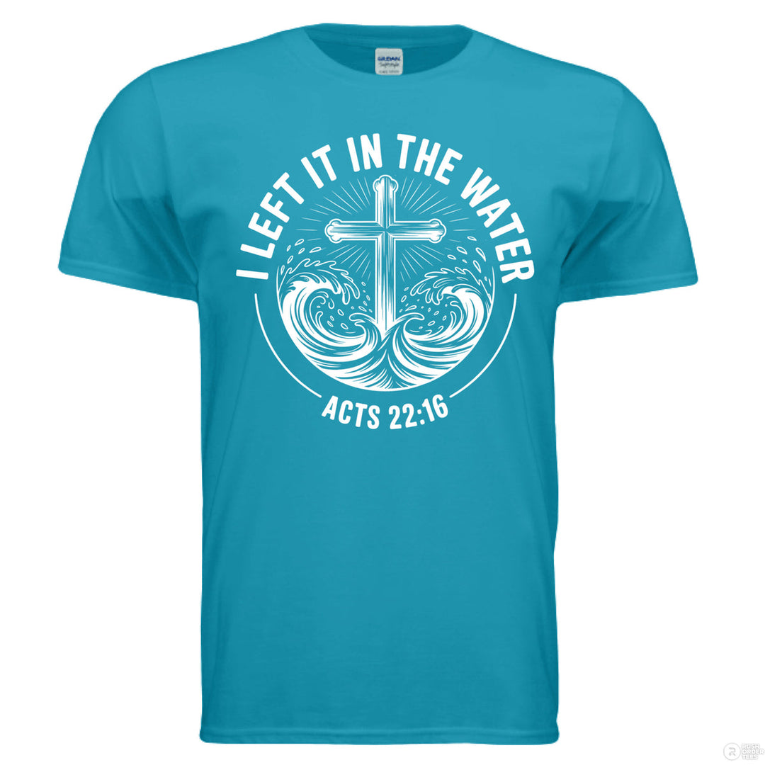 Tropical blue Christian t-shirt with a cross emerging from waves and the phrase ‘I Left It in the Water’ with Acts 22:16 in bold white text