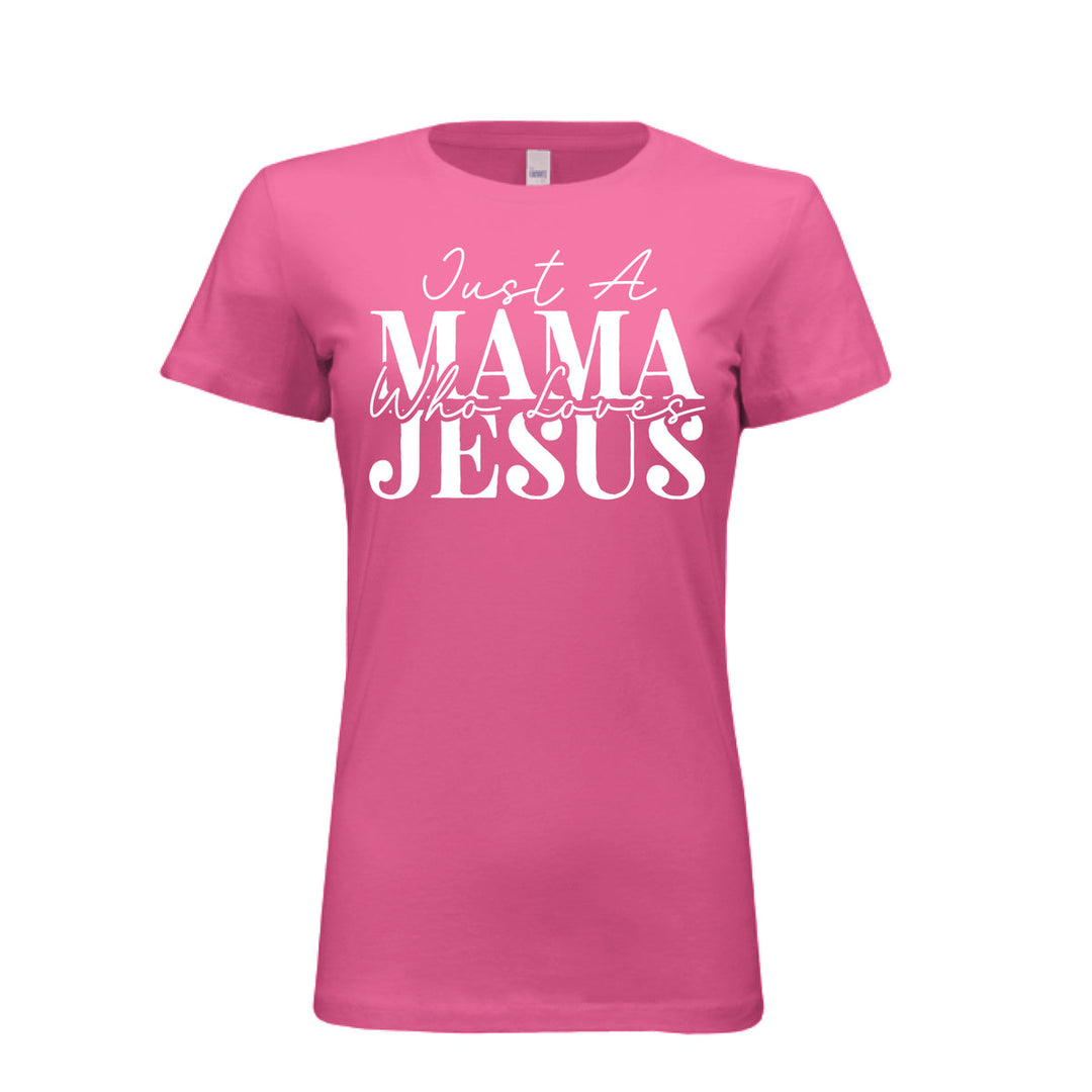 Women's berry pink t-shirt with white text reading "Just A Mama Who Loves Jesus" in bold and script fonts—a bold statement of faith and motherhood.