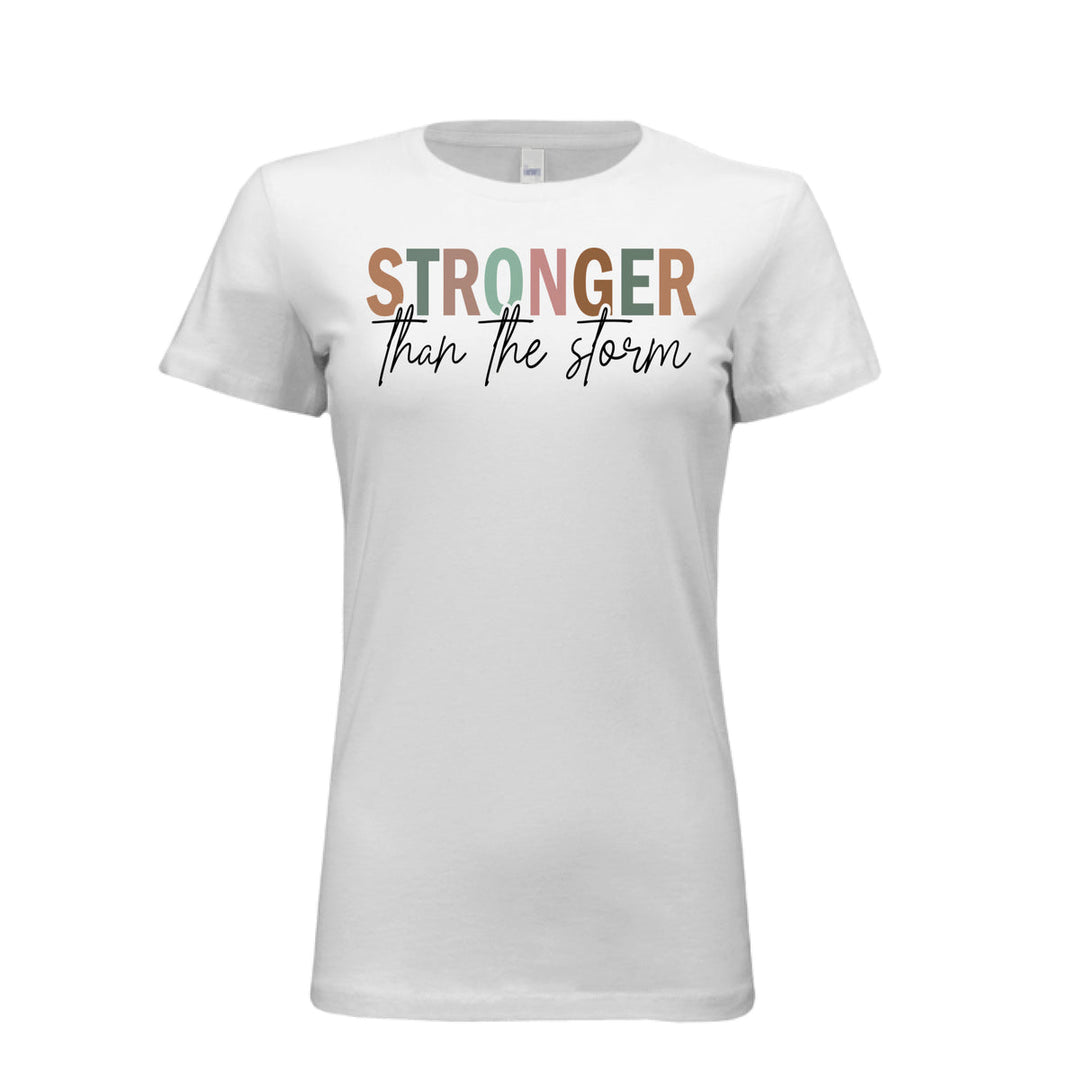 Women's fitted tee in white with bold multi-color “STRONGER” and black script “than the storm” across the chest.