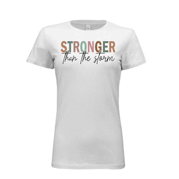 Women's fitted tee in white with bold multi-color “STRONGER” and black script “than the storm” across the chest.