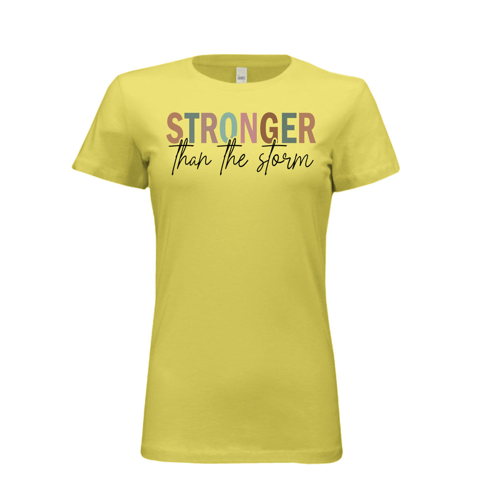 Women's fitted tee in yellow with bold multi-color “STRONGER” and black script “than the storm” across the chest.